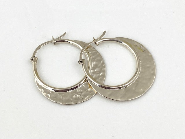 Sterling Silver Hammered hoop earrings by designer Guillermo Arregui. 