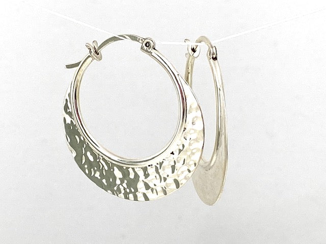 Sterling Silver Hammered hoop earrings by designer Guillermo Arregui.