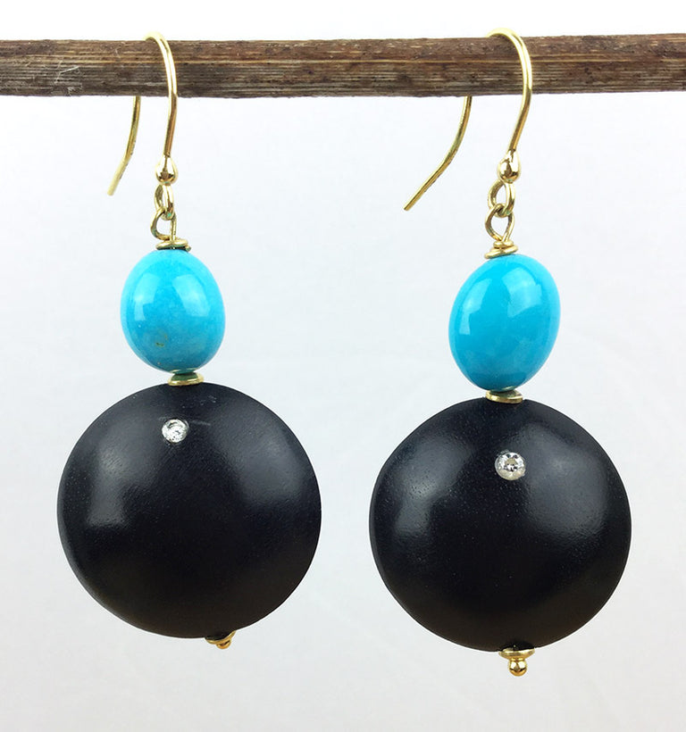 Sleeping beauty turquoise takes center stage in these 18k yellow gold earrings with ebony and diamonds.  