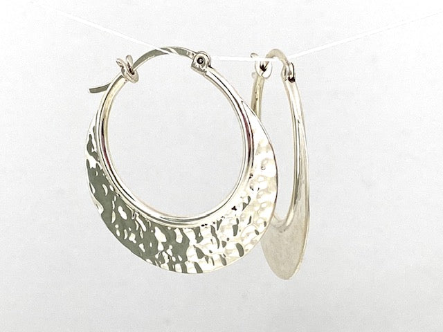 Sterling Silver Hammered hoop earrings by designer Guillermo Arregui. 