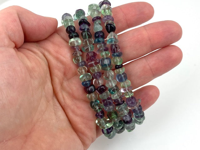 Four strands of multi-color fluorite nuggests witha  silver magnetic bar clasp made by EAT Gallery!
