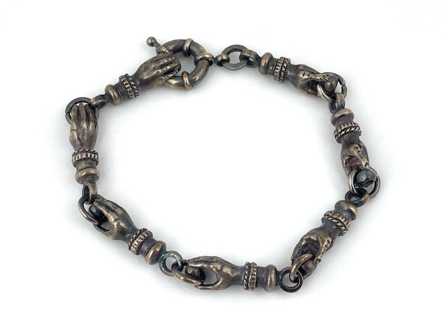 Funky 'hands' bracelet with vintage elements and a super spring ring clasp.  8 1/2"