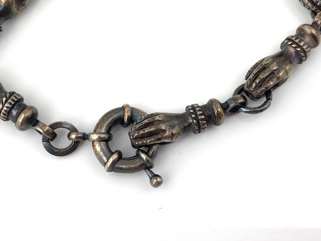 Funky 'hands' bracelet with vintage elements and a super spring ring clasp.  8 1/2"